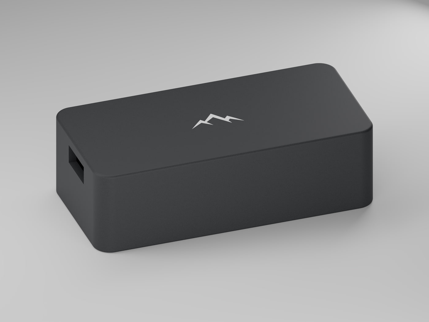 The NOMAE enclosure on a light studio background, showing the matte texture of the polymer